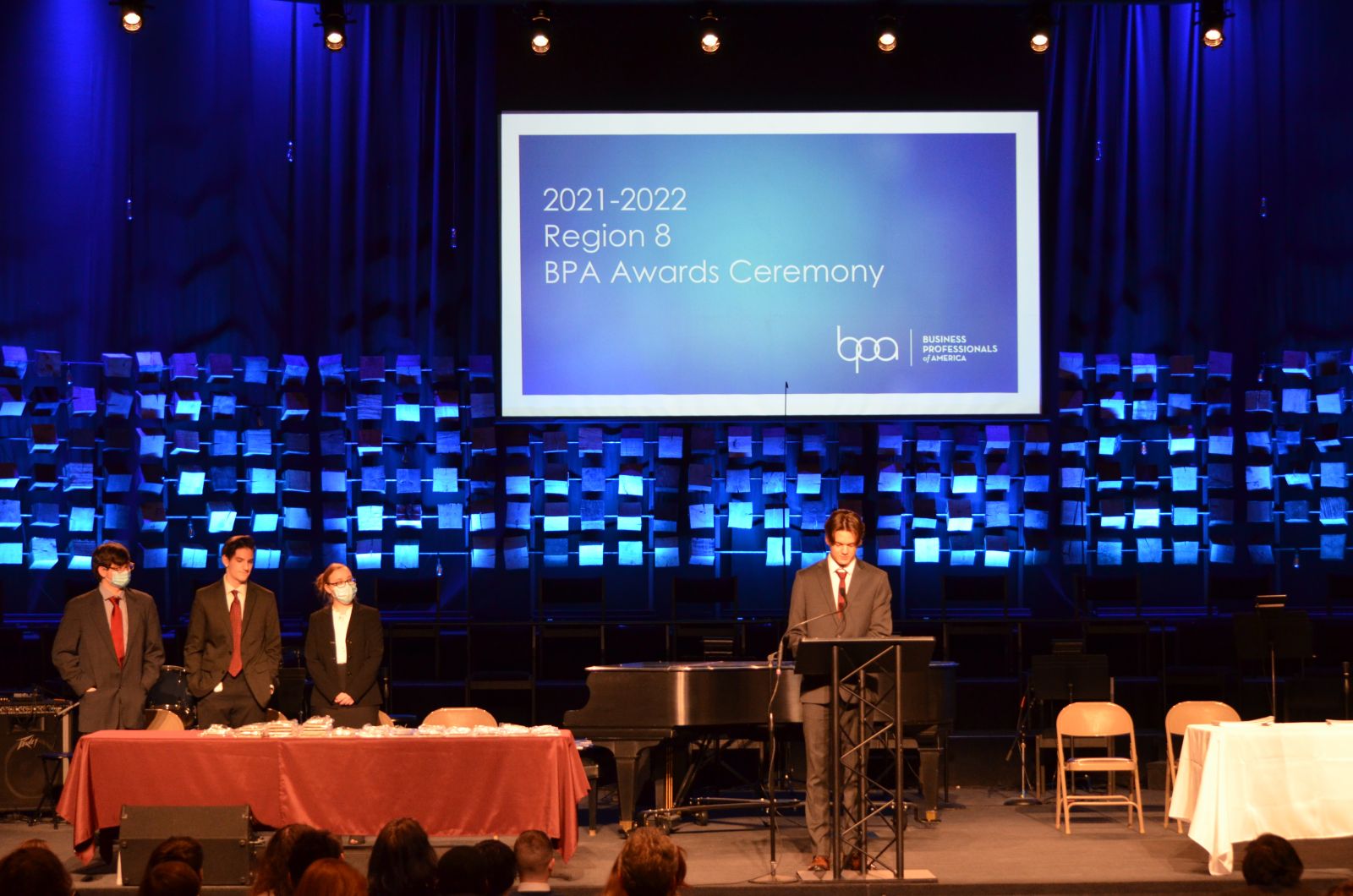 Wayne County Schools Career Center student Dominic Ferrell welcomes guests to the BPA Region 8 Awards.